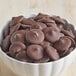 A bowl of chocolate candies made with semi-sweet chocolate wafers.
