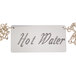 A Cal-Mil "Hot Water" sign with a chain around it.
