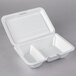 A Dart white foam takeout container with 2 compartments and a perforated hinged lid.