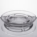 A clear glass ashtray with a circular rim.