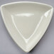 A white triangle shaped dish.