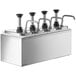 A stainless steel counter top with four ServSense stainless steel pumps.