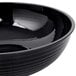 A black Cambro Camwear round ribbed bowl with a black rim.