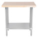 An Advance Tabco wood top work table with a stainless steel base and undershelf.