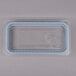 A plastic container with a clear rectangular lid with a blue border.