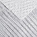 A close-up of a white fabric with a gray pattern.