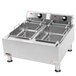 An APW Wyott commercial countertop deep fryer with two fryer tanks.