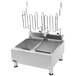 An APW Wyott stainless steel dual tank countertop deep fryer with two containers.