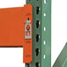 A close-up of a blue metal Vestil pallet racking frame post with a lock on it.
