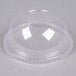 A clear Fabri-Kal plastic dome lid with a 1" hole on a table.
