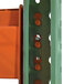 A green steel Vestil pallet racking frame with two holes in it.