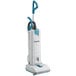 A Makita upright vacuum cleaner with a white base and blue handle.