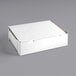 A white half sheet cake box with a lid.