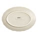An Acopa Condesa warm gray scalloped oval platter with a white oval design.