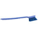 A Carlisle blue Sparta utility/pot scrub brush with a blue handle.