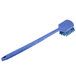 A blue Carlisle pot scrub brush with a long handle.