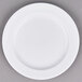 A white Arcoroc porcelain side plate with a white rim.