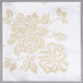 A white napkin with gold flowers and leaves.