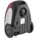 An Atrix Lil' Red canister vacuum in black and red with wheels.