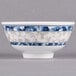 A close-up of a white melamine bowl with a blue dragon design.