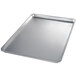 A close-up of a Chicago Metallic aluminum sheet pan with a semi-curled rim.