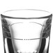 A Libbey fluted shot glass with a design on it.