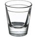 A close up of a Libbey clear shot glass with a 1 oz. pour line.