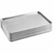 A stack of metal Choice aluminum perforated sheet pans.
