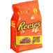 A bag of REESE'S 1M Baking Chips with peanut butter chips inside.