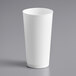 A white Choice plastic cup on a gray surface.