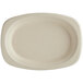 A white oval World Centric compostable fiber plate.