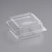 A clear plastic World Centric hinged clamshell container with a lid.