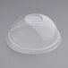 A World Centric clear plastic dome lid on a clear plastic container.