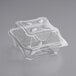 A World Centric clear compostable hinged clamshell container with a lid.