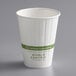 A white World Centric compostable paper hot cup.