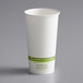 A white World Centric paper hot cup with a green stripe and label.