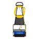 A Powr-Flite commercial floor scrubber with yellow hoses.