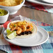 A Tuxton Concentrix white china plate with shrimp, black beans, and salsa on it.