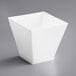 A white square container on a gray surface.