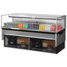 A Turbo Air stainless steel drop-in refrigerated display case filled with drinks on shelves.