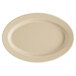 A white oval platter with a speckled sandstone surface.