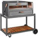 A Nuke BBQ Delta charcoal grill on a metal cart with a wood shelf.