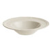 An Acopa Condesa warm gray porcelain bowl with a scalloped edge.