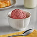 A bowl of Oringer Black Raspberry ice cream on a white background.