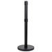 A black metal Aarco crowd control stanchion with a round base.