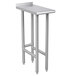 An Advance Tabco stainless steel filler table with metal legs.