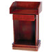 A wooden Aarco hostess podium with a drawer.