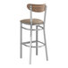A Lancaster Table & Seating bar stool with a taupe cushion and wood back.