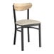 A Lancaster Table & Seating Boomerang Series black chair with a light gray vinyl seat and driftwood back.
