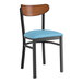 A Lancaster Table & Seating chair with a blue vinyl seat and black frame with wood accents.